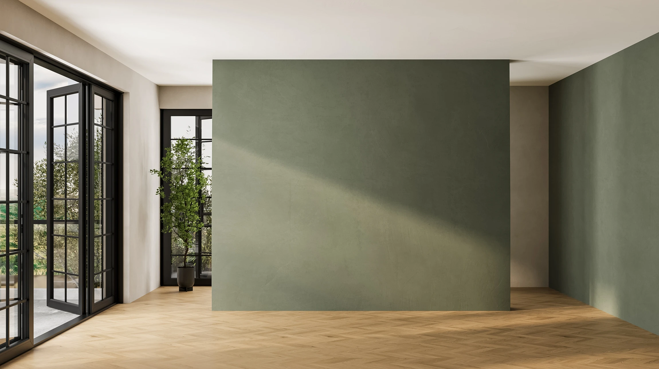 Ouvrier en bâtiment appliquant un enduit sur mur intérieur avec truelle, portant casque orange et combinaison grise